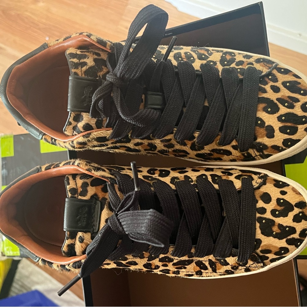 Woman’s size 8.5 coach shoes with hanging dinosaur dangle